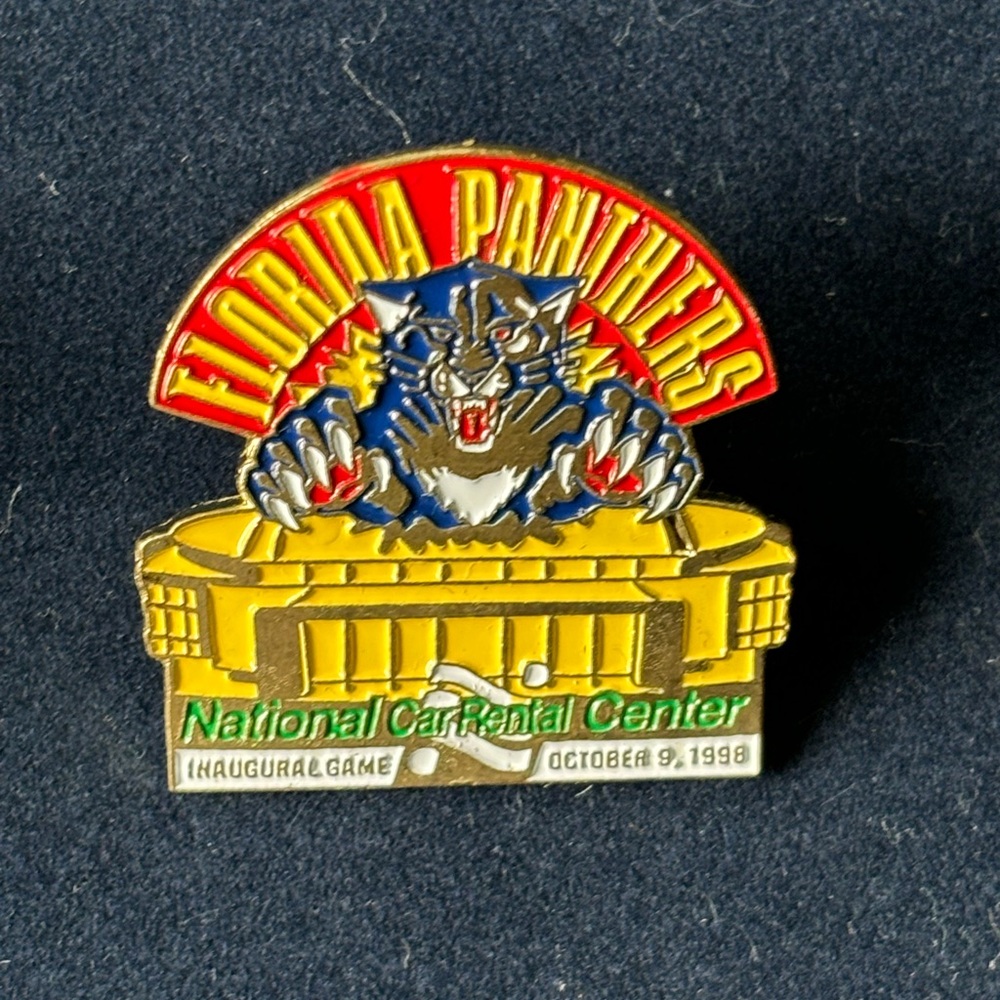 Vintage Florida Panthers pin collection, four pins and a commemorative coin